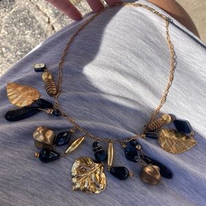 Vintage black and gold leaf necklace great to style up an outfit